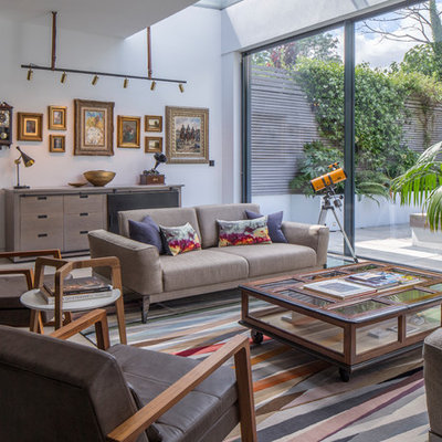 Living room - mid-sized contemporary open concept gray floor living room idea in London with white walls