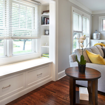 Mid-sized transitional enclosed medium tone wood floor living room photo in Minneapolis with gray walls, a standard fireplace, a tile fireplace and a wall-mounted tv