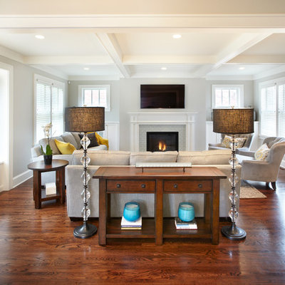 Mid-sized transitional enclosed medium tone wood floor living room photo in Minneapolis with gray walls, a standard fireplace, a tile fireplace and a wall-mounted tv