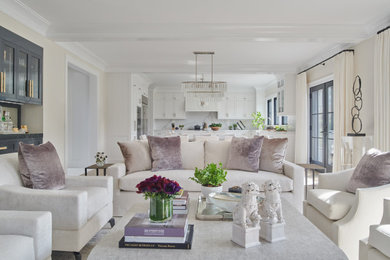 Example of a transitional open concept living room design in Other with white walls