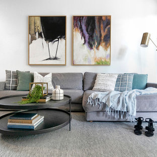 Contemporary living room in Sydney with white walls, medium hardwood floors and brown floor.