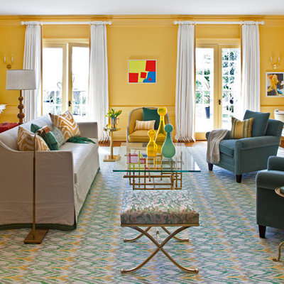 Example of a large eclectic formal and enclosed dark wood floor living room design in New York with yellow walls, no fireplace and no tv