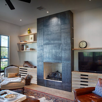 Steel clad fireplace, reclaimed pecan cabinets and shelves