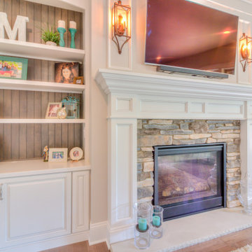 Stone faced gas fireplace with painted mantle