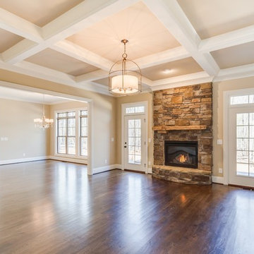 Stone fireplace flanked by french doors.
