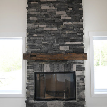 Stone Fireplace with Antique Wood Beam Mantle - Modern Barn Home