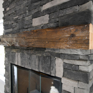 Stone Fireplace with Antique Wood Beam Mantle - Modern Barn Home