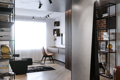 Imagen de salón para visitas tipo loft industrial de tamaño medio sin chimenea con paredes blancas, suelo laminado, televisor independiente y suelo beige