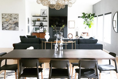 Large contemporary dining room in Los Angeles with grey walls.
