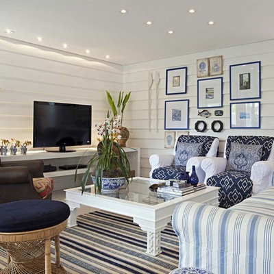 Inspiration for a contemporary living room remodel in Other with white walls and a tv stand