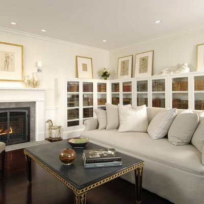 Trendy living room library photo in Boston with a standard fireplace