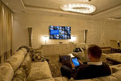 Photo of a medium sized modern formal open plan living room in London with a wall mounted tv.