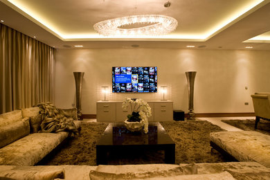 This is an example of a medium sized modern formal open plan living room in London with a wall mounted tv.