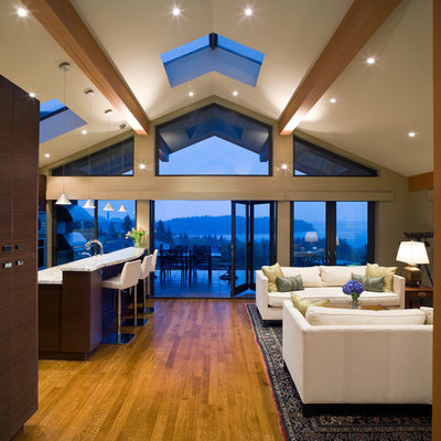 Inspiration for a contemporary open concept medium tone wood floor living room remodel in Vancouver