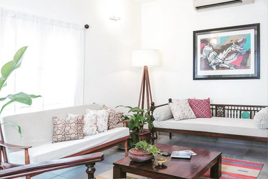 Island style living room photo in Chennai