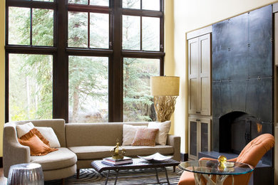 Trendy living room photo in Denver with beige walls and a standard fireplace