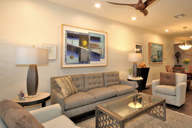 Foto di un soggiorno design aperto con pavimento in gres porcellanato e pavimento beige