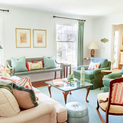 Inspiration for a timeless formal medium tone wood floor living room remodel in Cleveland with white walls