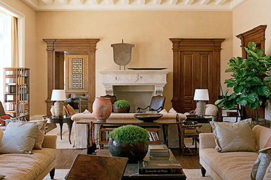 Example of a mid-sized formal medium tone wood floor living room design in New York with beige walls, a standard fireplace and a stone fireplace