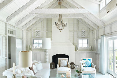 Example of a beach style formal painted wood floor and blue floor living room design in Boston with white walls and a standard fireplace