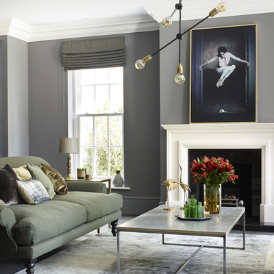 Living room - transitional living room idea in Surrey with gray walls and a standard fireplace