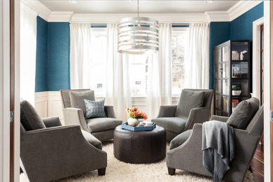Example of a transitional formal and enclosed dark wood floor living room design in Boston with blue walls and no tv