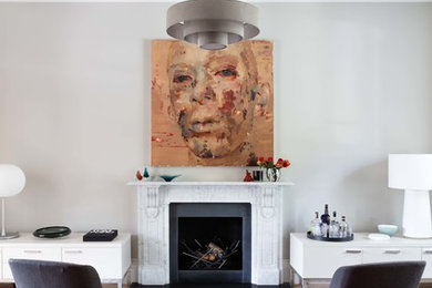 ロンドンにある高級な広い北欧スタイルのおしゃれなLDK (無垢フローリング、標準型暖炉、石材の暖炉まわり) の写真