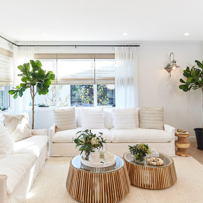 Living room - large transitional open concept beige floor living room idea in Sydney with white walls and a wall-mounted tv