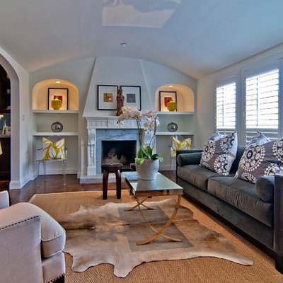 Elegant dark wood floor living room photo in San Francisco with a standard fireplace