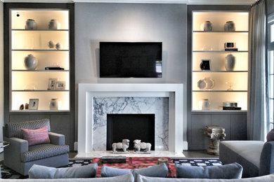 Large trendy open concept ceramic tile and gray floor living room library photo in Houston with gray walls, a standard fireplace, a tile fireplace and a wall-mounted tv