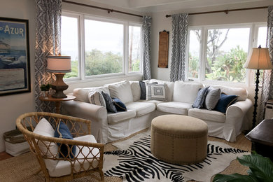 Medium sized eclectic formal enclosed living room in Santa Barbara with beige walls, medium hardwood flooring, no fireplace, no tv and brown floors.