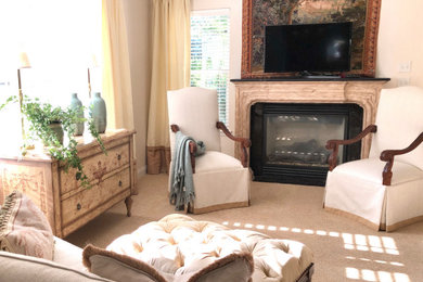 Inspiration for a mid-sized french country carpeted and beige floor living room remodel in Cedar Rapids with white walls, a stone fireplace and a tv stand