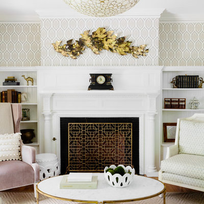 Mid-sized elegant formal and open concept medium tone wood floor and brown floor living room photo in Boston with multicolored walls, a standard fireplace, a plaster fireplace and no tv
