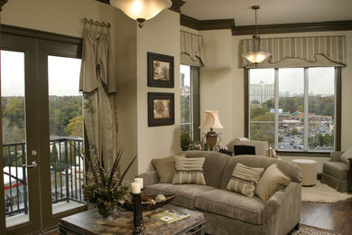 Example of a small transitional open concept medium tone wood floor living room design in Atlanta with gray walls