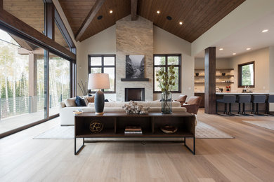 Living room - cottage light wood floor living room idea in Salt Lake City with beige walls, a standard fireplace and no tv