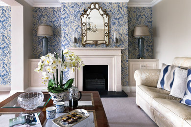 Photo of a large classic formal living room in Essex with blue walls, a standard fireplace and a plastered fireplace surround.