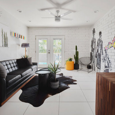 Living room - mid-sized contemporary formal and enclosed white floor and brick wall living room idea in Phoenix with white walls and no tv