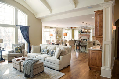 Example of a mid-sized farmhouse formal and open concept medium tone wood floor living room design in Milwaukee with beige walls, a standard fireplace, a tile fireplace and a wall-mounted tv