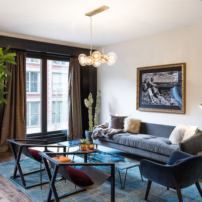 Mid-sized trendy formal and open concept light wood floor living room photo in New York with black walls and no tv