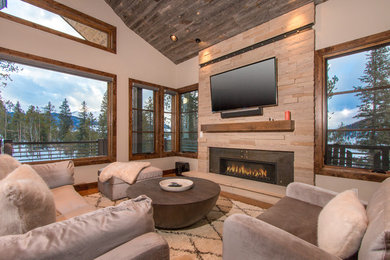 Example of a mid-sized mountain style formal and enclosed dark wood floor and brown floor living room design in Denver with beige walls, a ribbon fireplace, a wood fireplace surround and a wall-mounted tv