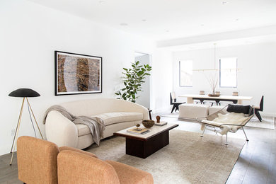 Photo of a contemporary formal open plan living room in Los Angeles with white walls, dark hardwood flooring, no fireplace and brown floors.