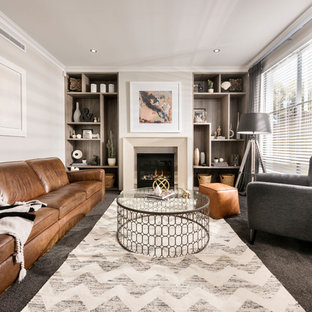 This is an example of a medium sized classic formal and grey and cream living room in Perth with carpet, a standard fireplace and no tv.