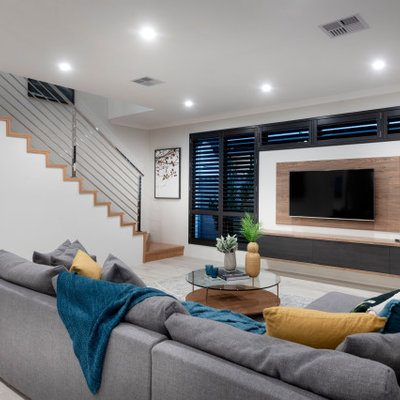 Inspiration for a large contemporary carpeted and gray floor living room remodel in Perth with white walls and a wall-mounted tv
