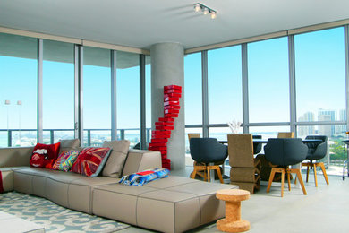 Trendy concrete floor living room photo in Miami