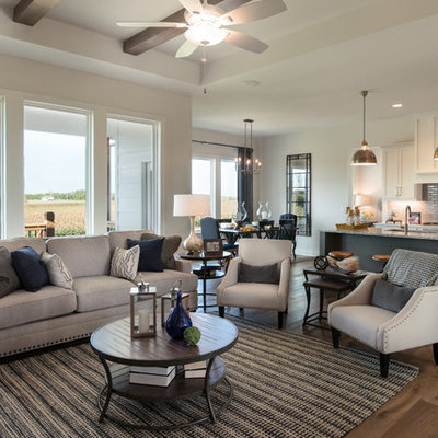 Example of a mid-sized cottage open concept medium tone wood floor living room design in Wichita with white walls, a standard fireplace and a stone fireplace