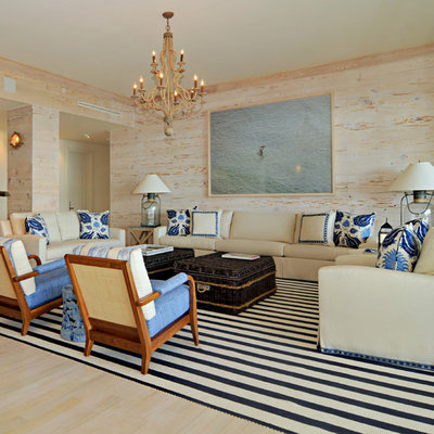 Example of a large island style formal and open concept light wood floor and beige floor living room design in Miami with multicolored walls, no fireplace and no tv
