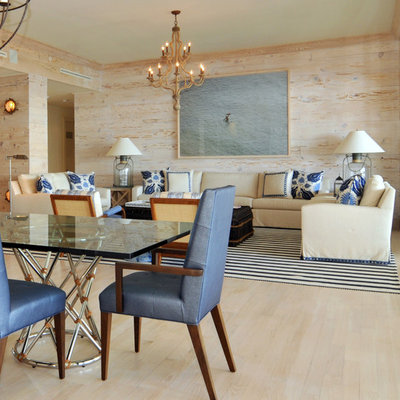 Example of a large island style formal and open concept light wood floor and beige floor living room design in Miami with multicolored walls, no fireplace and no tv