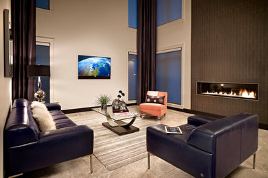 This is an example of a contemporary open plan living room in Edmonton with a wall mounted tv.