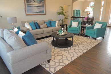 Mid-sized elegant enclosed medium tone wood floor living room photo in St Louis with beige walls