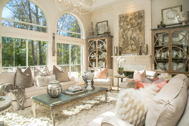 Inspiration for a shabby-chic style living room remodel in Houston with white walls and a standard fireplace
